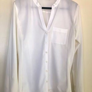 NWOT. Calvin Klein women’s White Long Sleeves Shirt.Size 6 Tag out. Never used.